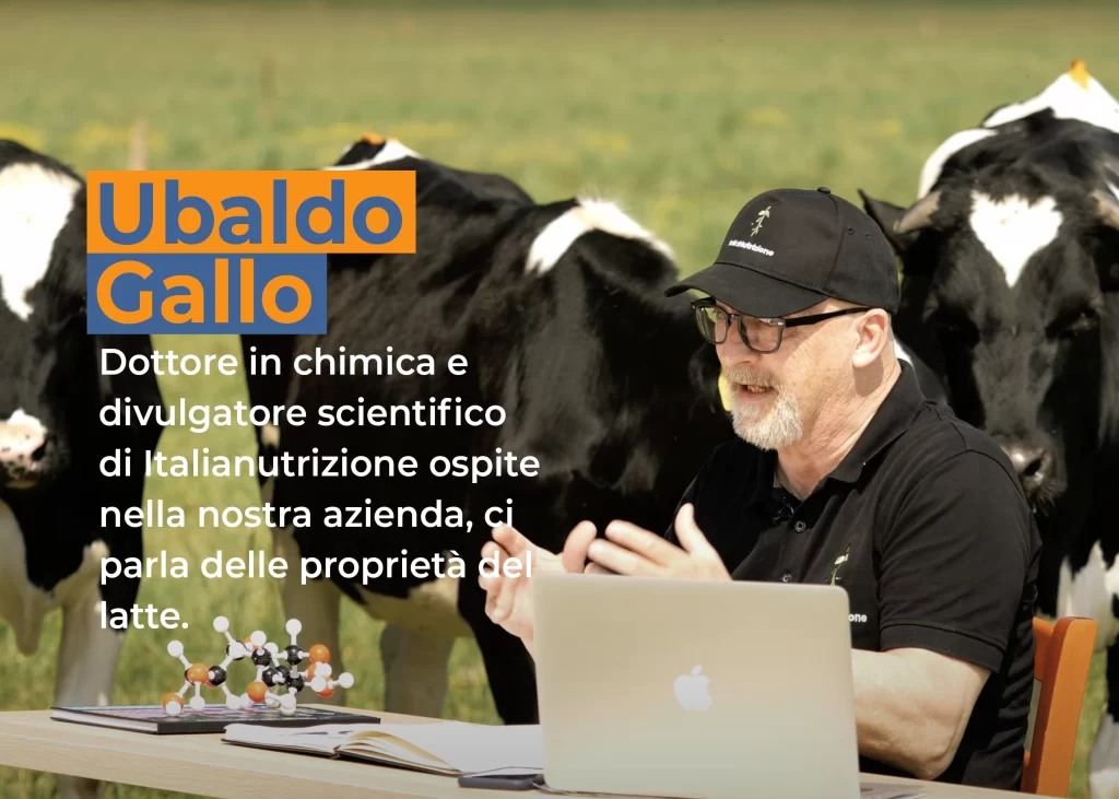 Frame video YouTube di italianutrizione. Nel frame si vede il dottore in chimica Ubaldo Gallo mentre spiega le proprietà del latte seduto su una scrivania all'aperto. Dietro di lui, pascolano tranquille le mucche dell'azienda agricola Mc Elan